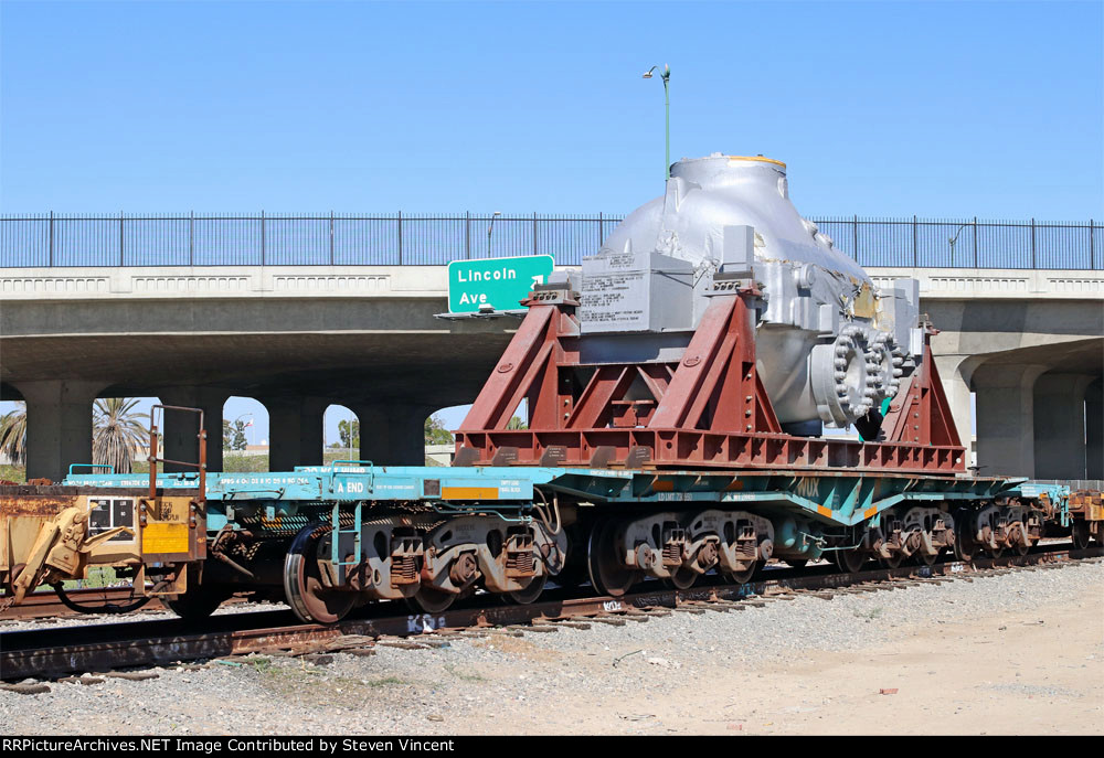 Heavy duty flat KWUX #13 with load for a turbine project in Huntington Beach.